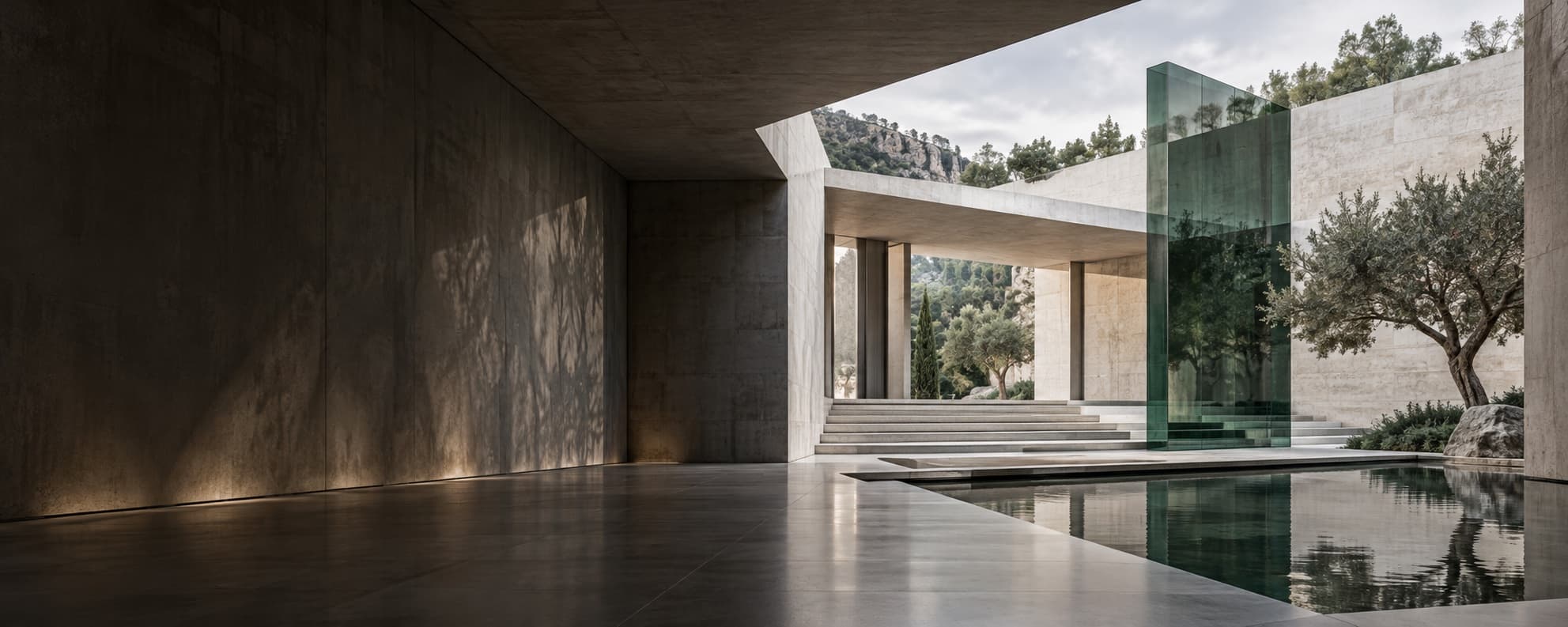 Modern stone and glass architecture with an emerald glass structure